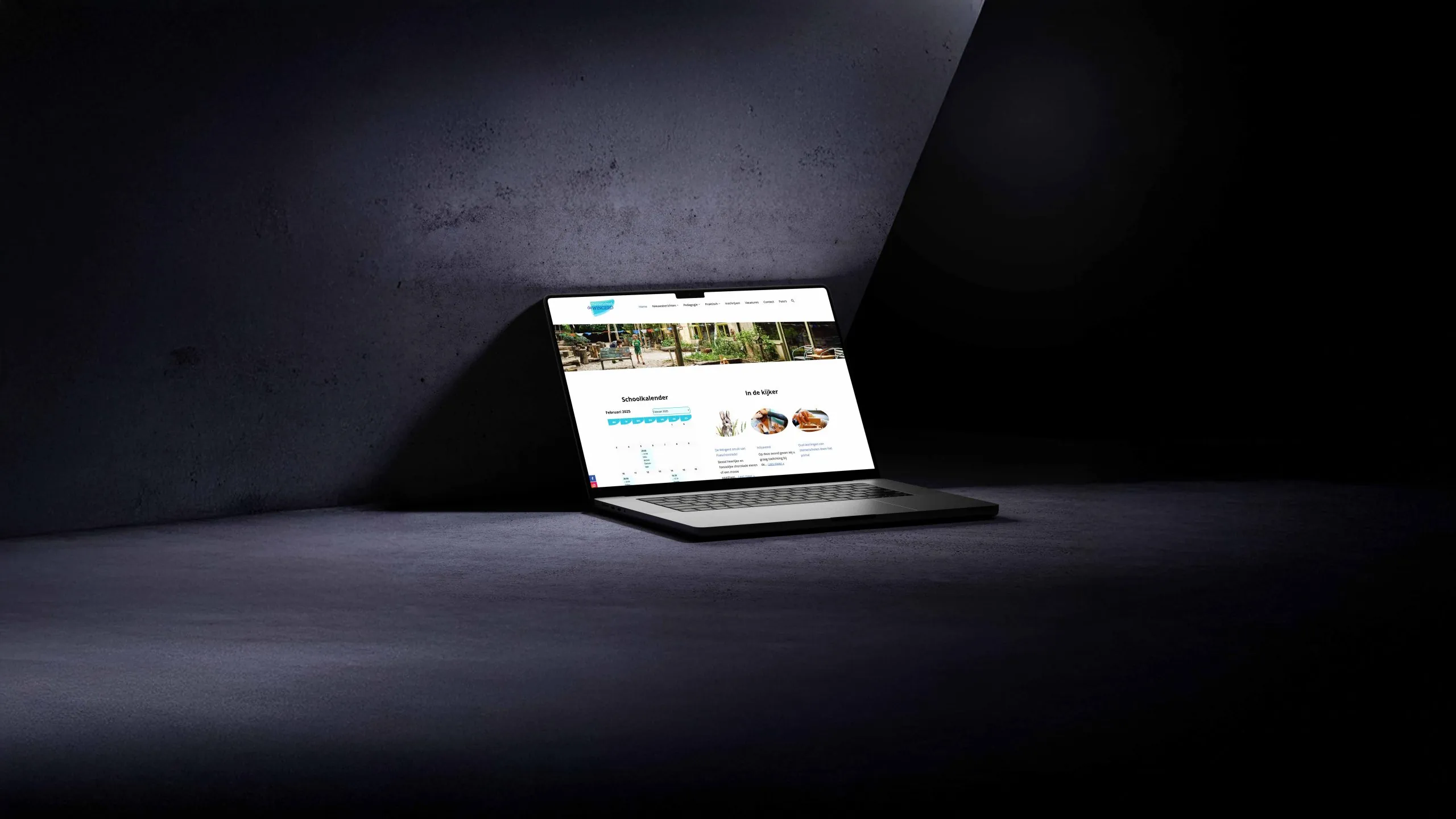 Homepage van de website van Steinerschool De Wingerd op een laptop